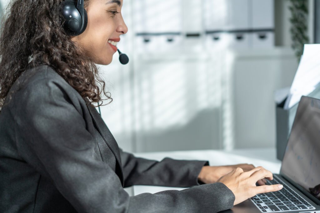 Latino beautiful business woman call center smile while work in office.